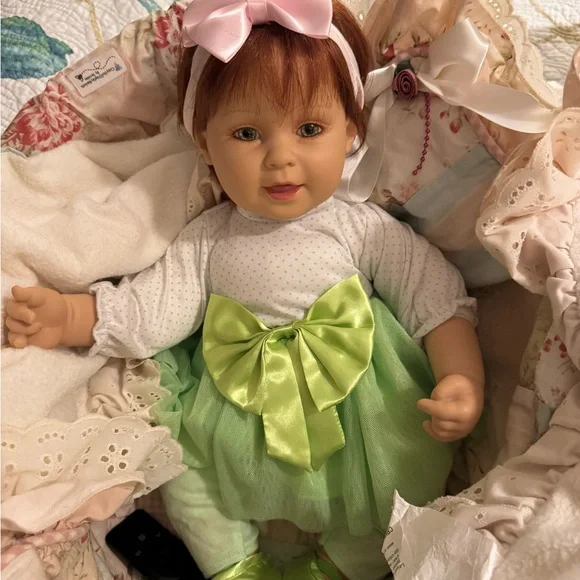 Adorable Baby Doll with Pink Bow - Picture 4 of 9